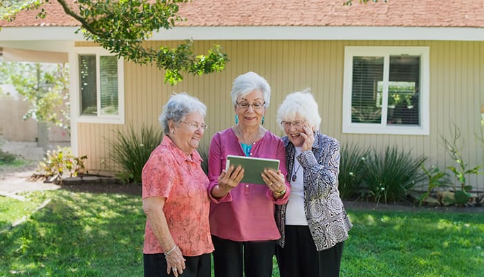 Fredericka Manor residents reading outside