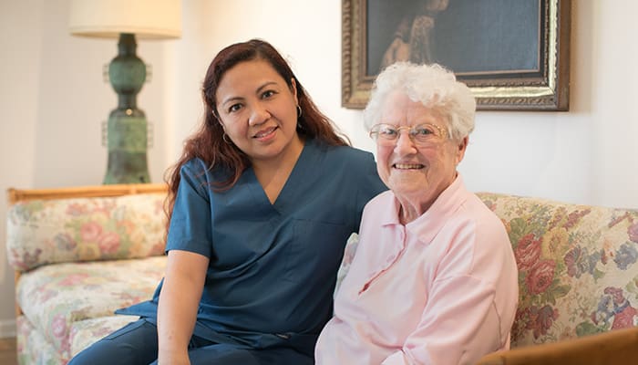 Portrait of smiling staff member and resident at Vista del Monte