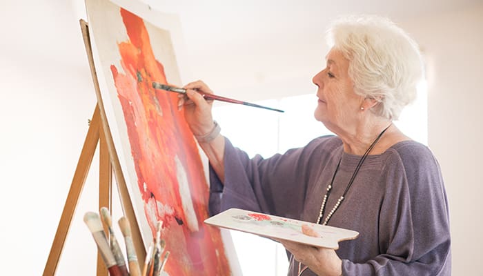Portrait of woman painting in an art studio