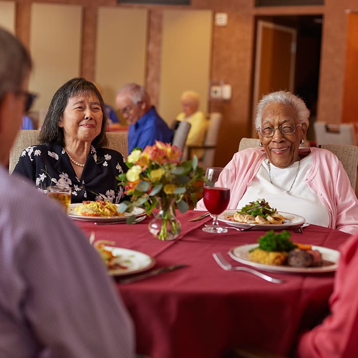 Residents of Webster House dining in the dining room
