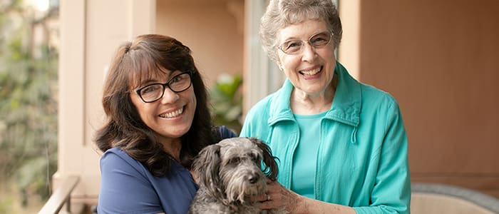 caregiver and resident with dog