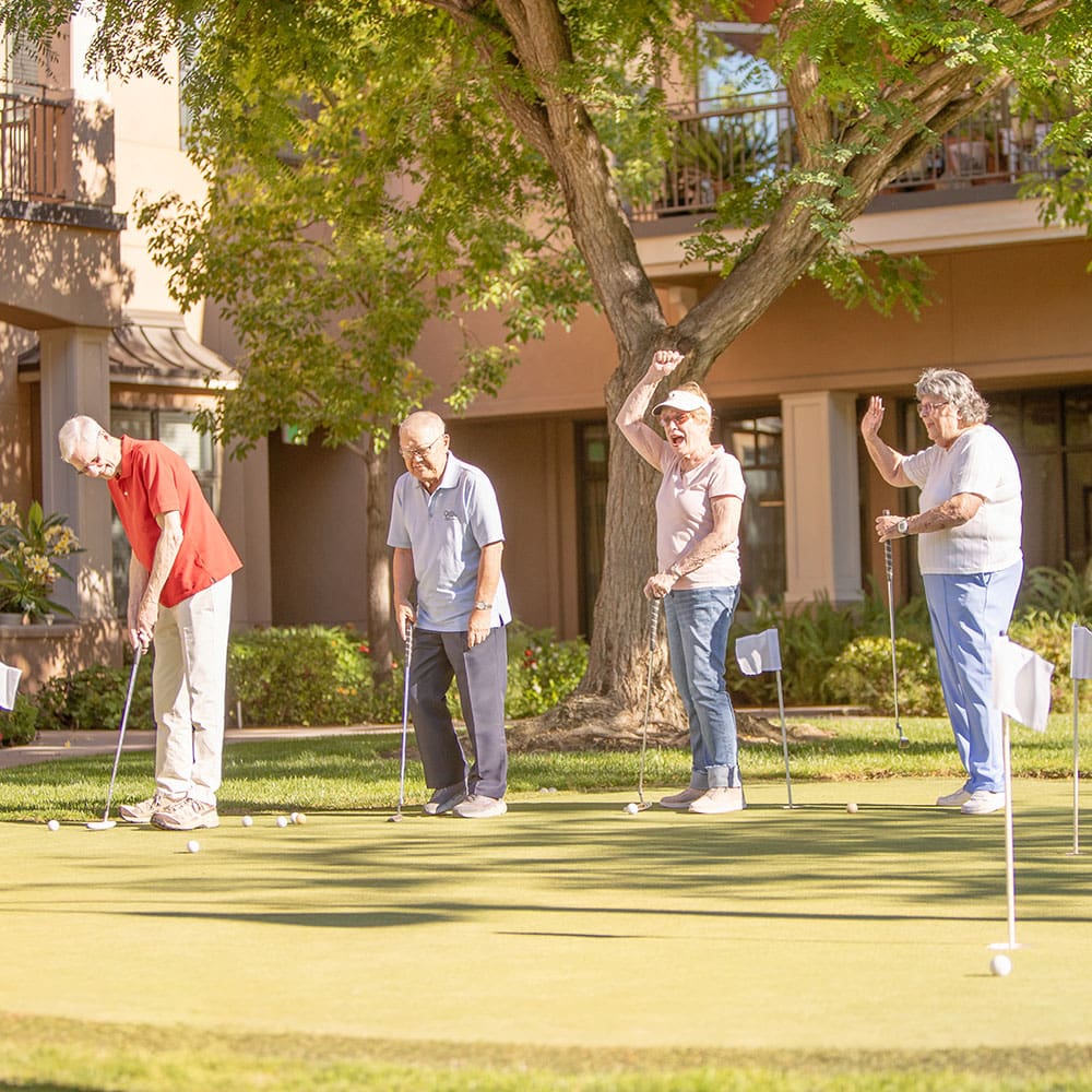 Residents on the putting green, one of the many activities offered at Walnut Village