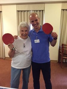 two residents playing ping pong