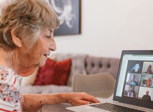 A resident talks to a group on Zoom