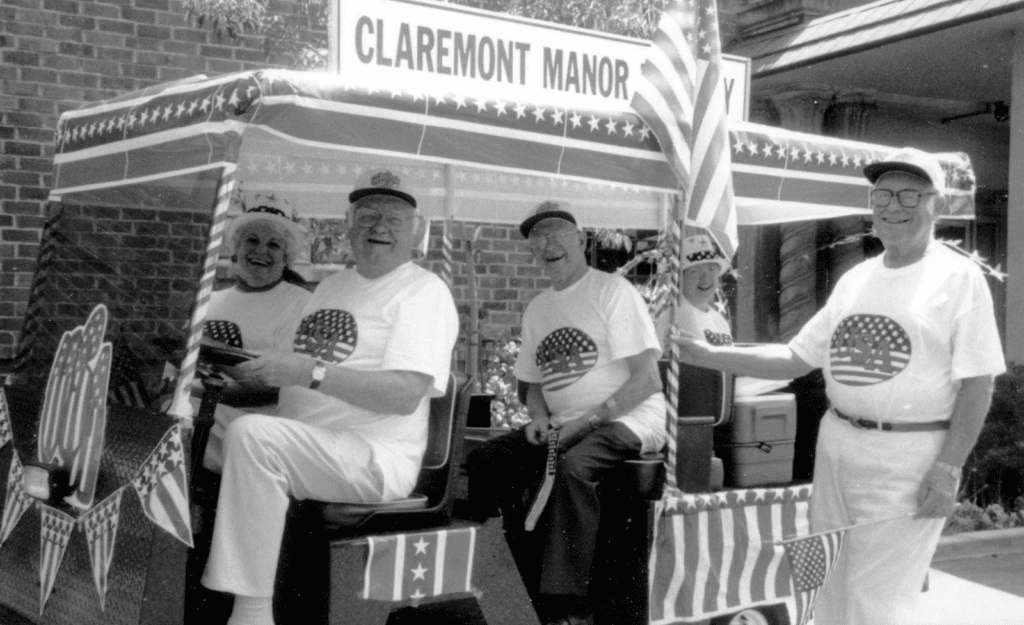 Claremont Manor residents in golf cart parade