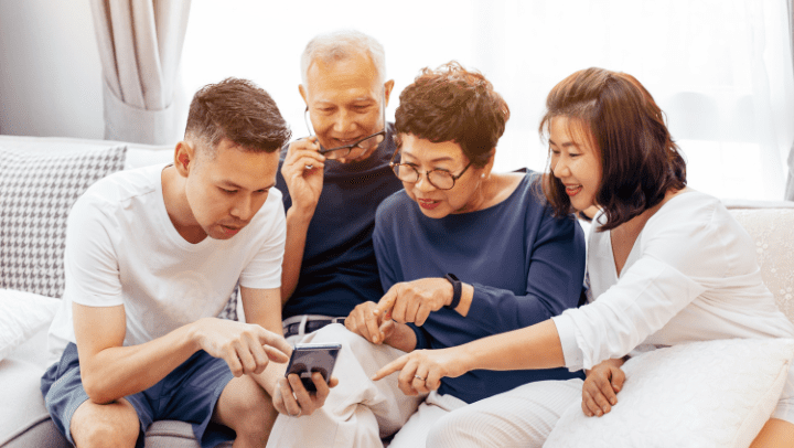 a family checking information on a cell phone