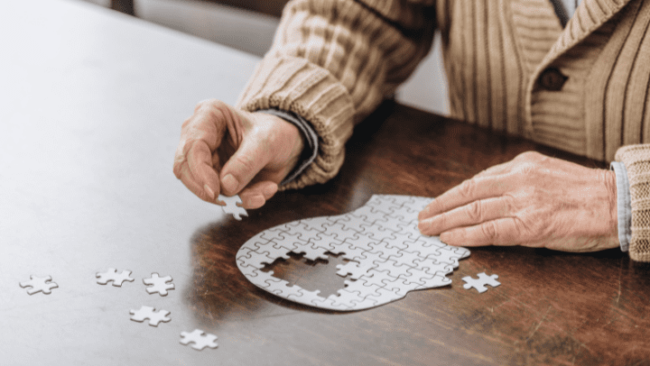 an old man making a puzzle