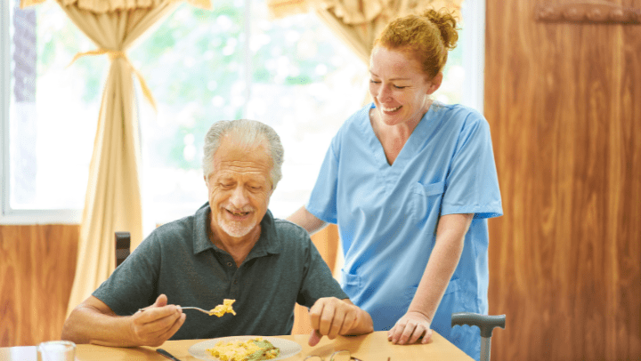 a nurse helping an old senior