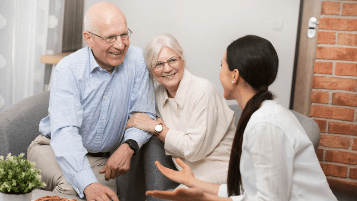 two seniors with a woman
