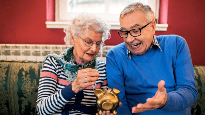 an elderly couple with their retirement savings