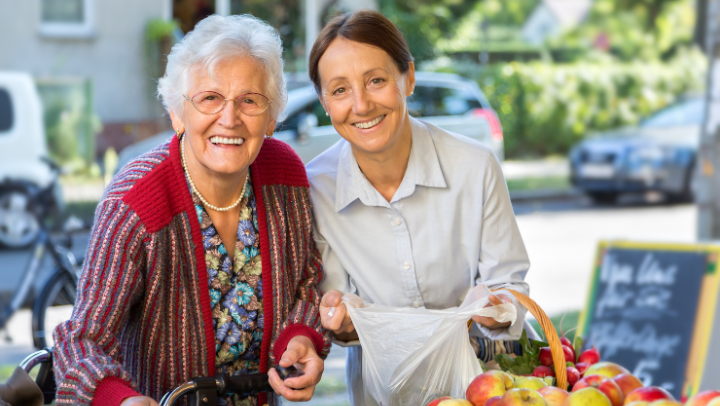 and old lady and a nurse smiling