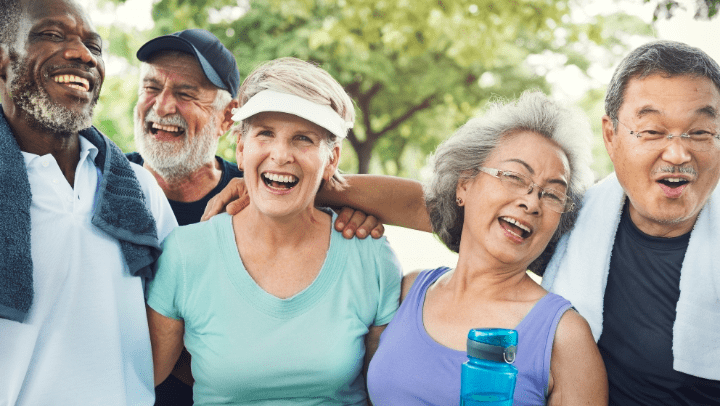 a group of seniors smiling after exercising