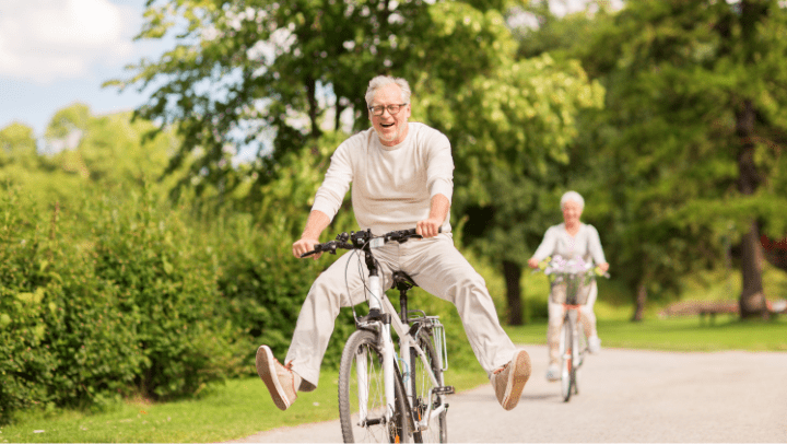 an old senior riding a bicycle 