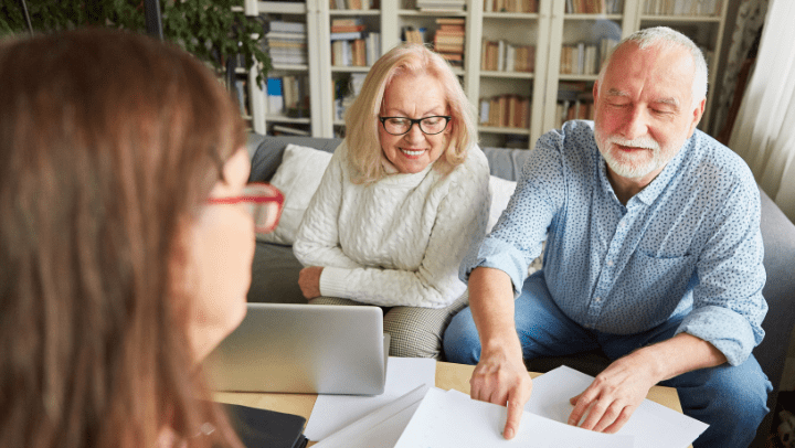 Seniors planning with a woman.
