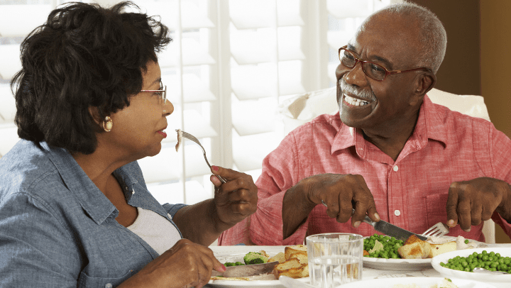 two seniors eating