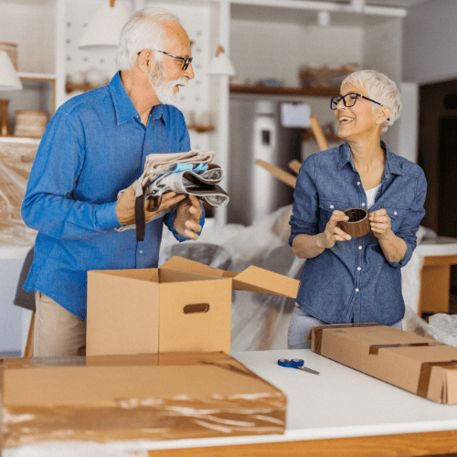 elderly couple packing up for a move