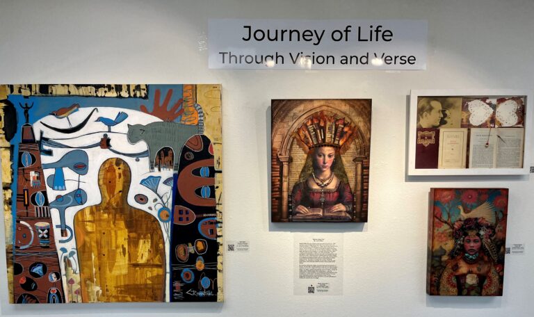 Artworks hung on a white wall. Sign above says Journey of Life.