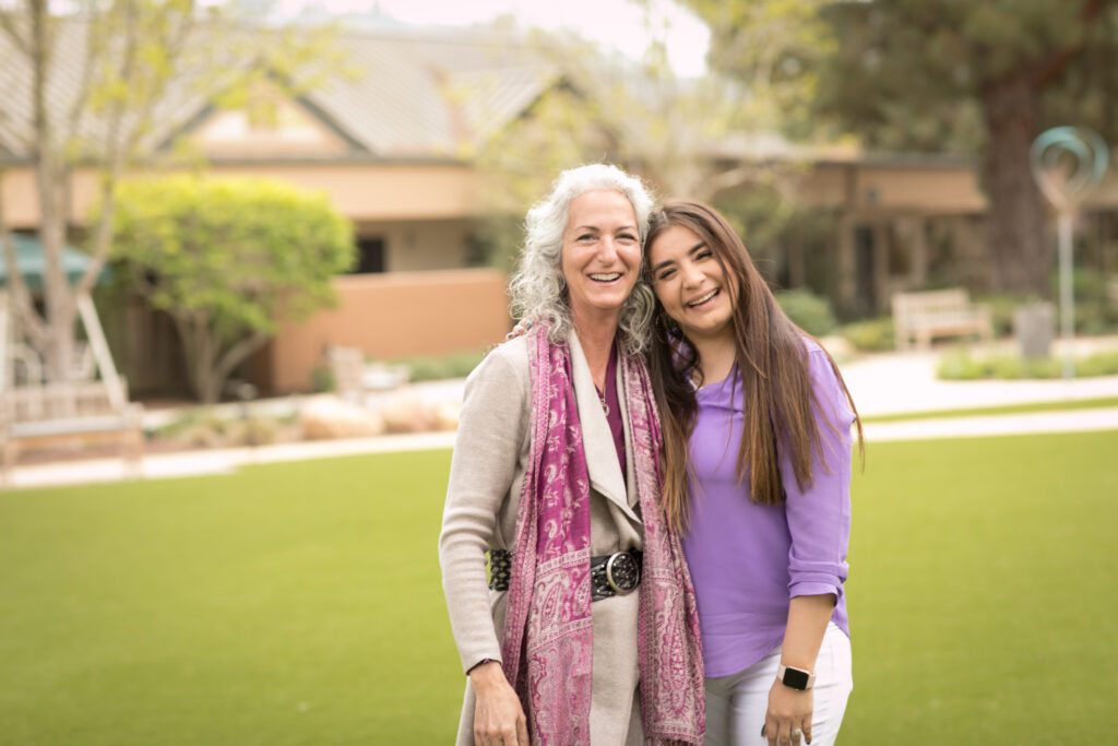 two womans smiling