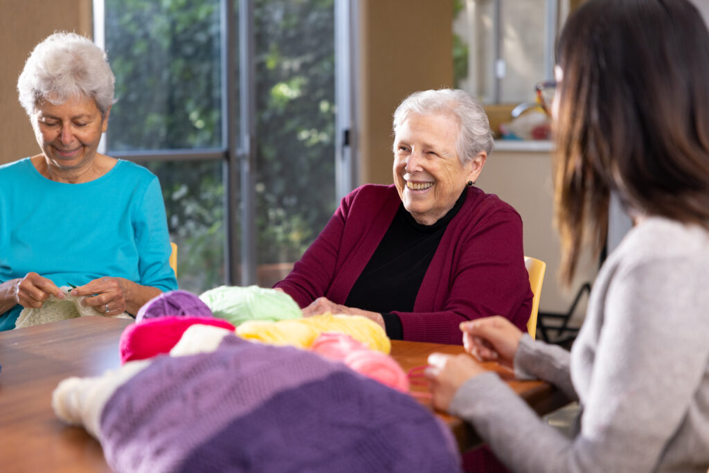 a senior lady knitting 