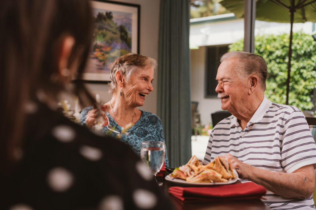 a couple of seniors smiling each other