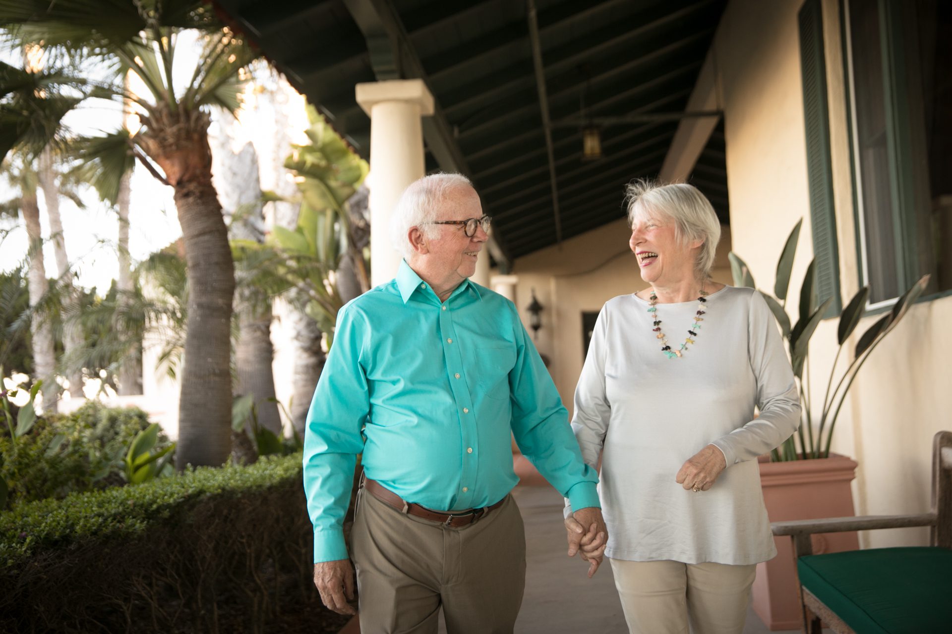 a couple of old people holding hands