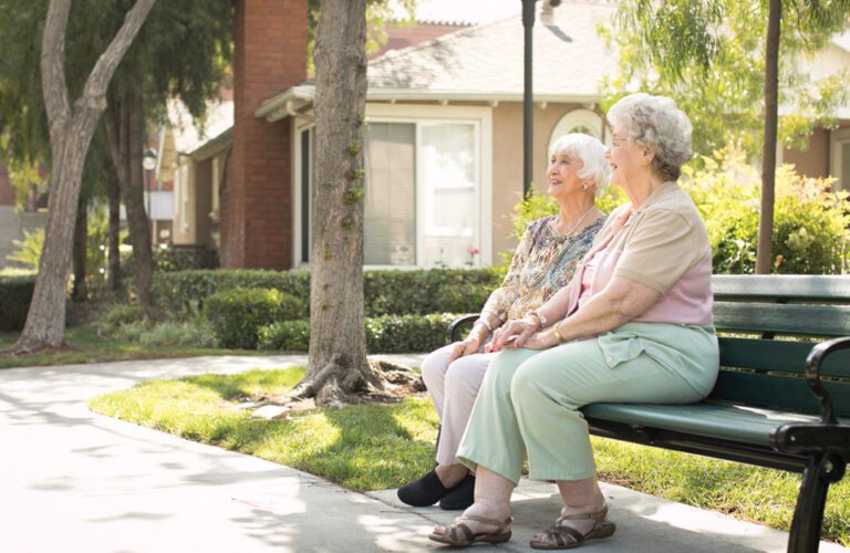 a couple of ladies talking outdoors