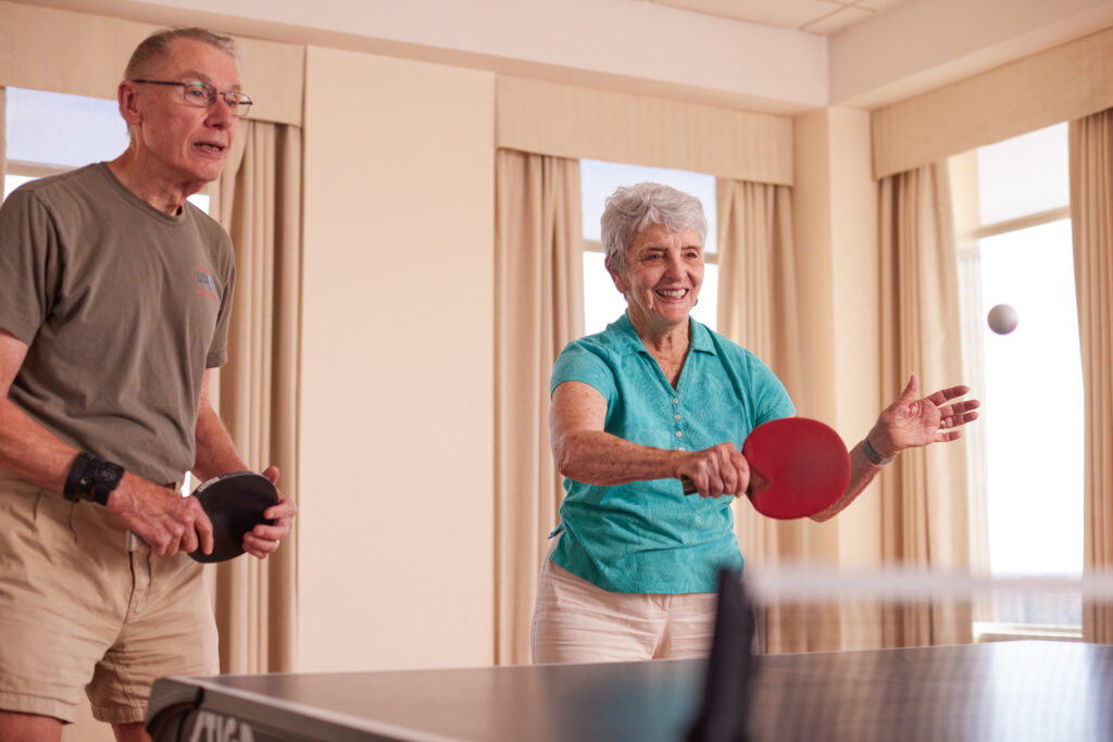 two old pals playing table tennis 