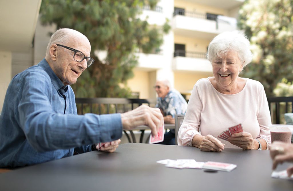 an old couple playing cards