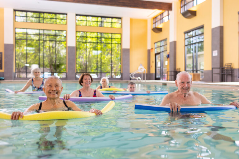 a group seniors exercising in a swimming pool