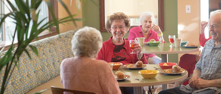 a group of seniors having breakfast