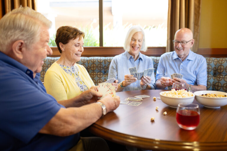 Residents gathered at Walnut Village's Red Chair Lounge