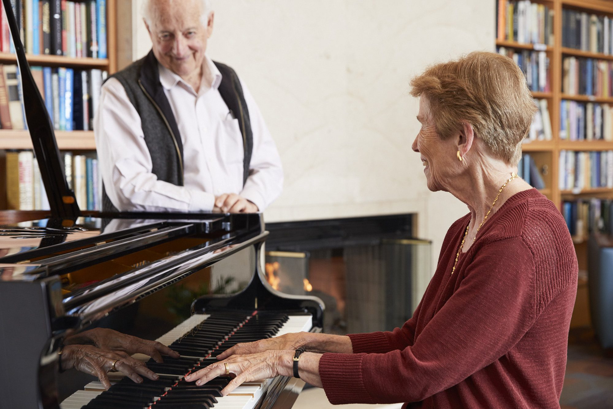 Old lady learning how to play the piano