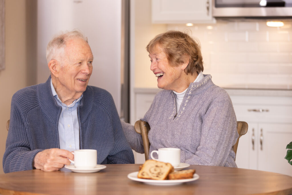 a senior couple taking coffee