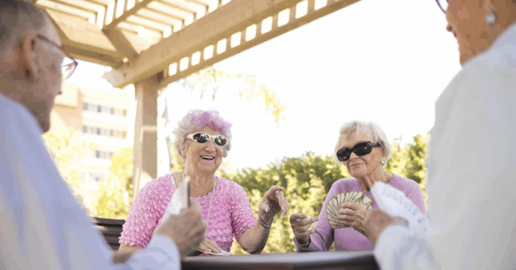 seniors playing cards at independent living