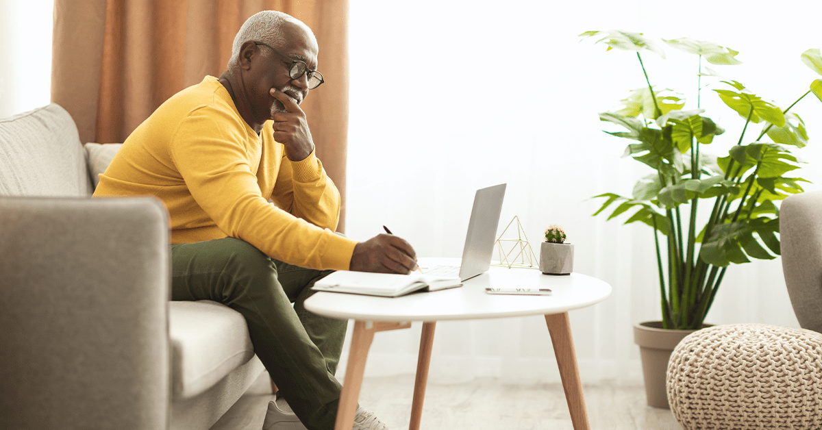 an old men looking at a computer
