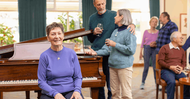 a group of people standing around a piano