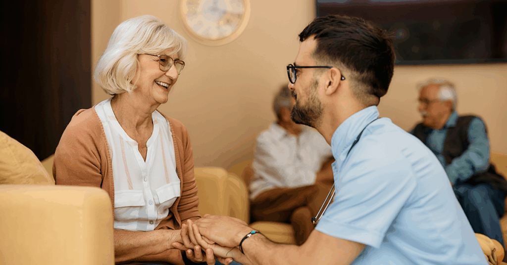 a senior lady holding hand with her son