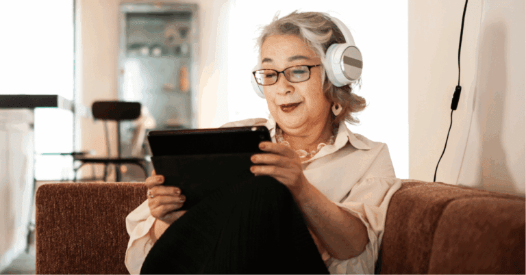 senior lady listening her favorite podcast with her headphones