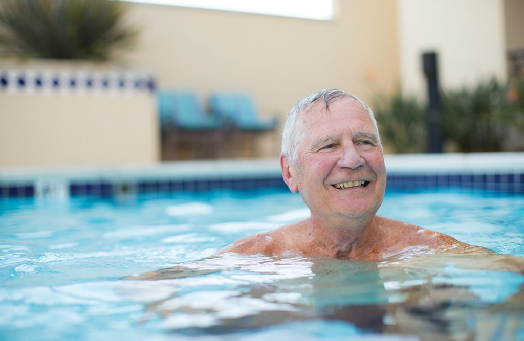 an old men in the pool