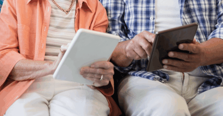 a senior couple using their ipads at senior living
