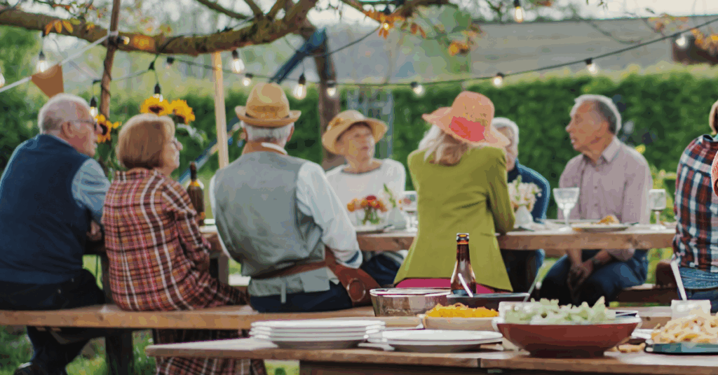 a group of seniors having dinner at independent living
