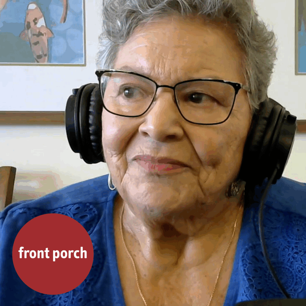 An older woman wearing headphones looks off screen. The Front Porch logo is in the lower left corner.