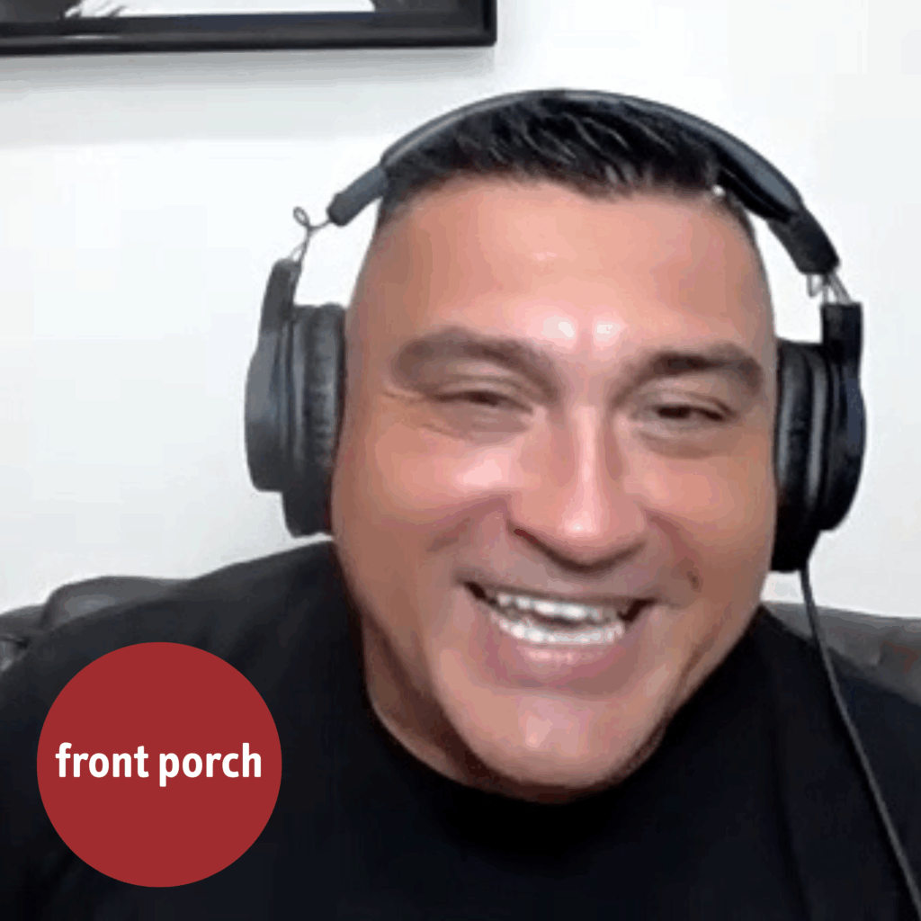 A man wearing headphones smiles. The Front Porch ball logo is in the bottom left corner.