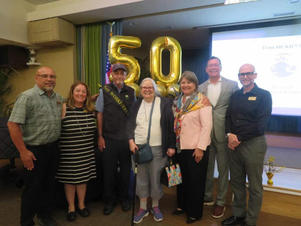 Front Porch In The Media: Media Highlights And News Roundup From June-July 2026 1 A Group Of People Standing In Front Of Balloons Spelling Out 50.