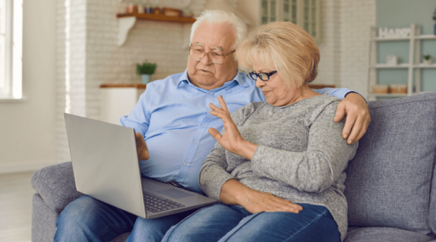 an elderly family making a video call with their family