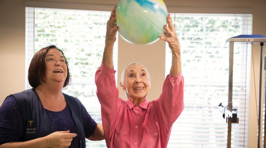 a senior lady playing with a ball