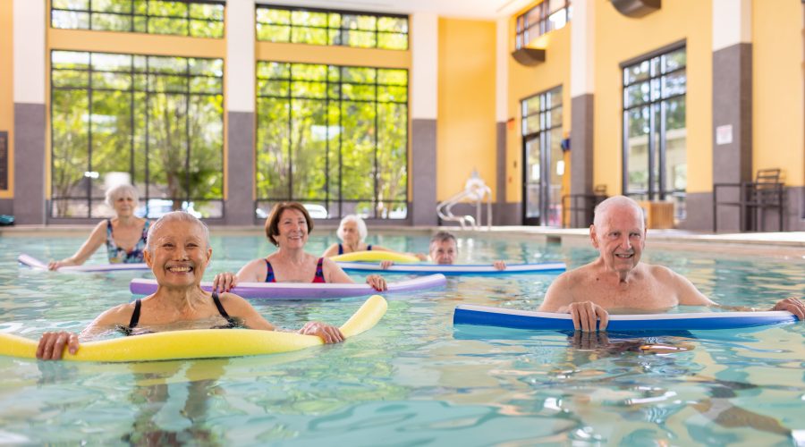 a group seniors exercising in a swimming pool