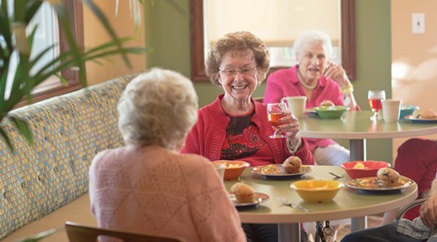 a group of seniors having breakfast