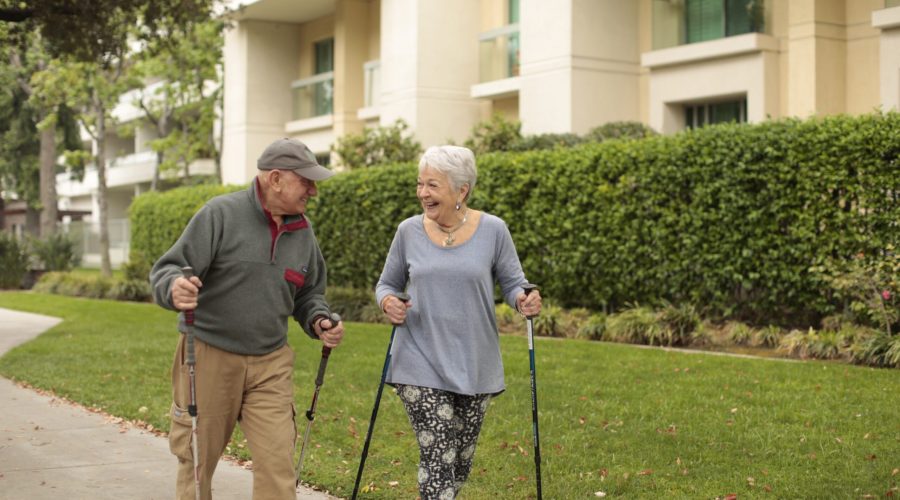 Portrait of residents enjoying a walk around the Villa Gardens community