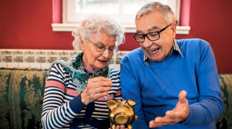 an elderly couple with their retirement savings